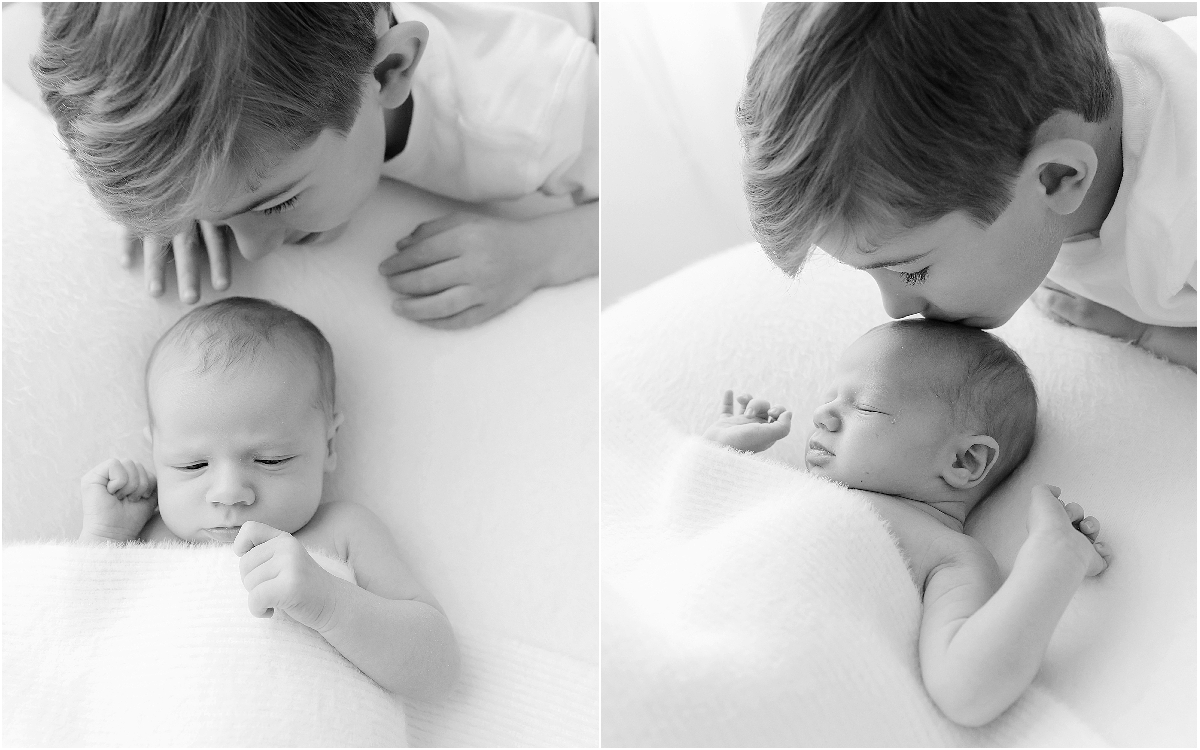 A newborn baby sleeps while his proud brother looks on and smiles in a newborn photography studio in raleigh